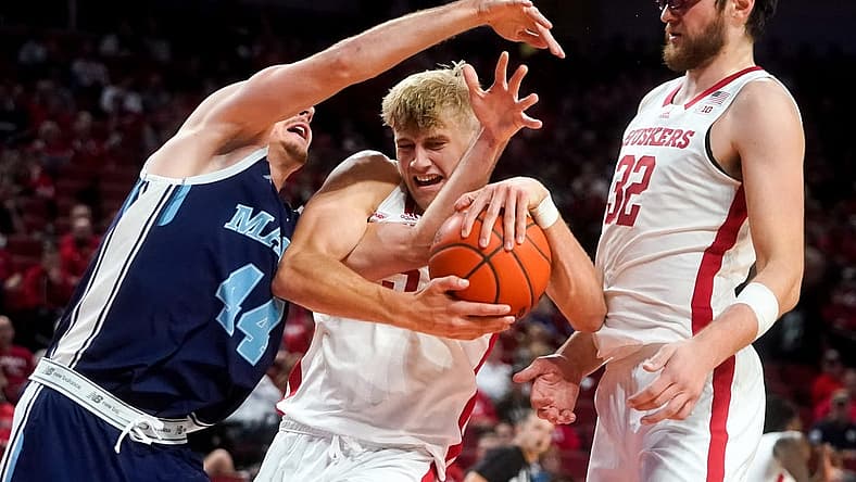 Nov 7, 2022; Lincoln, Nebraska, USA; Nebraska Cornhuskers guard Sam Griesel (5) fights for the ball against Maine Black Bears forward Peter Filipovity (44) during the second half at Pinnacle Bank Arena. Mandatory Credit: Dylan Widger-USA TODAY Sports