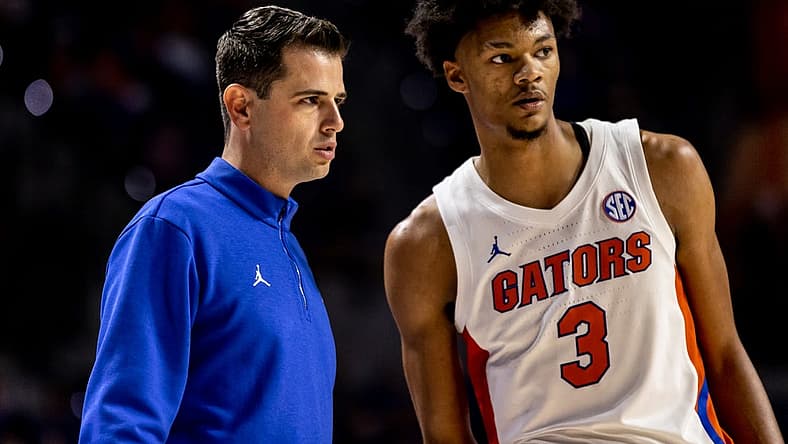 Nov 7, 2022; Gainesville, Florida, USA; Florida Gators head coach Todd Golden talks with Florida Gators forward Alex Fudge (3) in a timeout during the second half against the Stony Brook Seawolves at Exactech Arena at the Stephen C. O'Connell Center. Mandatory Credit: Matt Pendleton-USA TODAY Sports