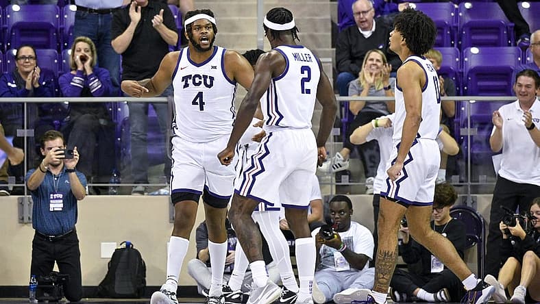Nov 7, 2022; Fort Worth, Texas, USA; TCU Horned Frogs center Eddie Lampkin Jr. (4) and forward Emanuel Miller (2) celebrate during the second half against the Arkansas-Pine Bluff Golden Lions at Ed and Rae Schollmaier Arena. Mandatory Credit: Jerome Miron-USA TODAY Sports