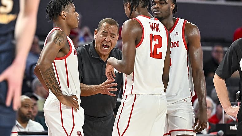 Nov 7, 2022; Houston, Texas, USA; Houston Cougars head coach Kelvin Sampson speaks with guard Tramon Mark (12), guard Marcus Sasser (0) and forward Jarace Walker (25) during the second half against the Northern Colorado Bears at Fertitta Center. Mandatory Credit: Maria Lysaker-USA TODAY Sports