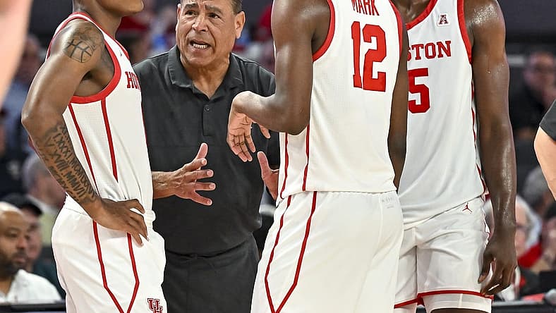 Nov 7, 2022; Houston, Texas, USA; Houston Cougars head coach Kelvin Sampson speaks with guard Tramon Mark (12) and guard Marcus Sasser (0) and forward Jarace Walker (25) during the second half against the Northern Colorado Bears at Fertitta Center. Mandatory Credit: Maria Lysaker-USA TODAY Sports