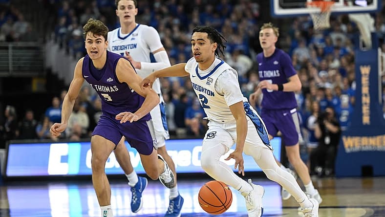 Nov 7, 2022; Omaha, Nebraska, USA; Creighton Bluejays guard Ryan Nembhard (2) drives up the court against St. Thomas - Minnesota Tommies forward Parker Bjorklund (5)during the second half at CHI Health Center Omaha. Mandatory Credit: Steven Branscombe-USA TODAY Sports
