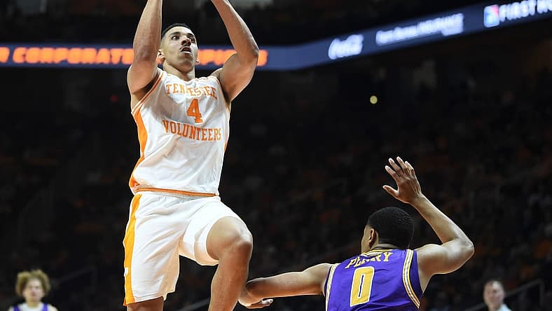 Tennessee guard Tyreke Key (4) tries to score over Tennessee Tech guard Ty Perry (0) during an NCAA college basketball game between Tennessee and Tennessee Tech on Monday, November 7, 2022 in Knoxville, Tenn.

Kns Vols Hoops Tntech