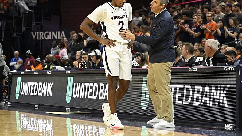 Nov 7, 2022; Charlottesville, Virginia, USA; Virginia Cavaliers guard Reece Beekman (2) has a chat with head coach Tony Bennett before taking a seat on the bench in game against North Carolina Central in the second half at John Paul Jones Arena. Mandatory Credit: Lee Luther Jr.-USA TODAY Sports