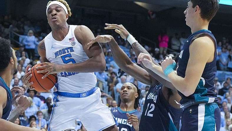 Nov 7, 2022; Chapel Hill, North Carolina, USA; North Carolina Tar Heels forward Armando Bacot (5) grabs a rebound against the North Carolina-Wilmington Seahawks during the second half at Dean E. Smith Center. Mandatory Credit: James Guillory-USA TODAY Sports