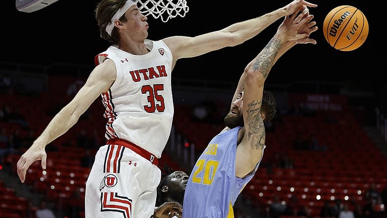 Nov 7, 2022; Salt Lake City, Utah, USA;  Utah Utes center Branden Carlson (35) and LIU Sharks forward Jake Cook (20) battle for the ball in the first half at Jon M. Huntsman Center. Mandatory Credit: Jeffrey Swinger-USA TODAY Sports