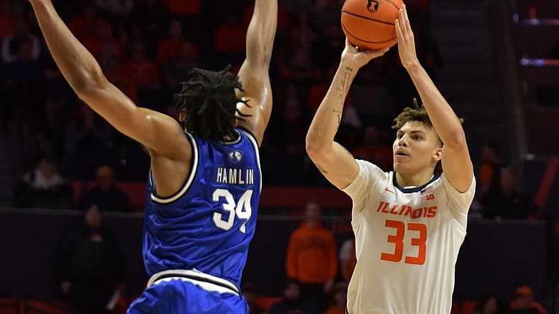 Nov 7, 2022; Champaign, Illinois, USA; Illinois Fighting Illini forward Coleman Hawkins (33) shoots the ball over Eastern Illinois Panthers forward Jermaine Hamlin (34) during the first half at State Farm Center. Mandatory Credit: Ron Johnson-USA TODAY Sports