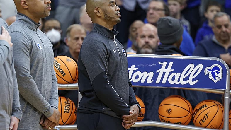 Nov 9, 2022; Newark, New Jersey, USA; Seton Hall Pirates head coach Shaheen Holloway (right) stands during the national anthem before the game against the Monmouth Hawks at Prudential Center. Mandatory Credit: Vincent Carchietta-USA TODAY Sports