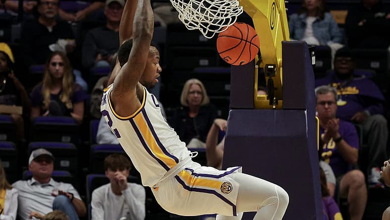 Nov 9, 2022; Baton Rouge, Louisiana, USA; LSU Tigers forward KJ Williams (12) dunks the ball against the UMKC Kangaroos during the second half at Pete Maravich Assembly Center. Mandatory Credit: Stephen Lew-USA TODAY Sports