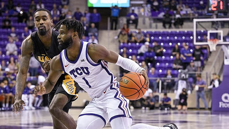Nov 7, 2022; Fort Worth, Texas, USA; Arkansas-Pine Bluff Golden Lions guard Shaun Doss Jr. (21) and TCU Horned Frogs guard Mike Miles Jr. (1) in action during the game between the TCU Horned Frogs and the Arkansas-Pine Bluff Golden Lions at Ed and Rae Schollmaier Arena. Mandatory Credit: Jerome Miron-USA TODAY Sports
