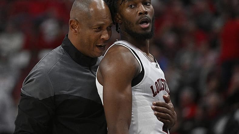 Nov 9, 2022; Louisville, Kentucky, USA; Louisville Cardinals head coach Kenny Payne talks with forward Roosevelt Wheeler (4) during the second half against the Bellarmine Knights at KFC Yum! Center. Bellarmine defeated Louisville 67-66. Mandatory Credit: Jamie Rhodes-USA TODAY Sports