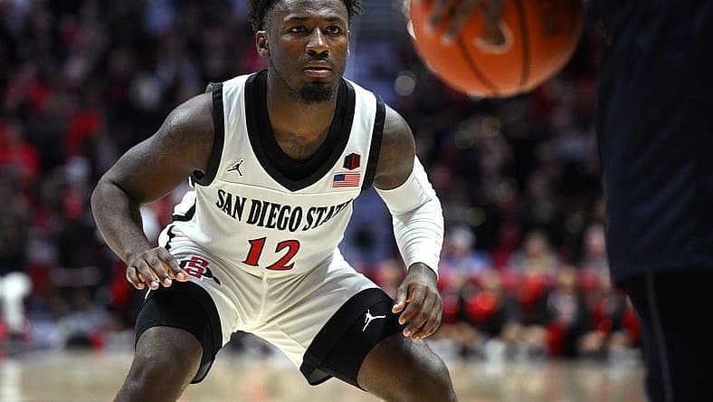 Nov 7, 2022; San Diego, California, USA; San Diego State Aztecs guard Darrion Trammell (12) defends during the second half against the Cal State Fullerton Titans at Viejas Arena. Mandatory Credit: Orlando Ramirez-USA TODAY Sports