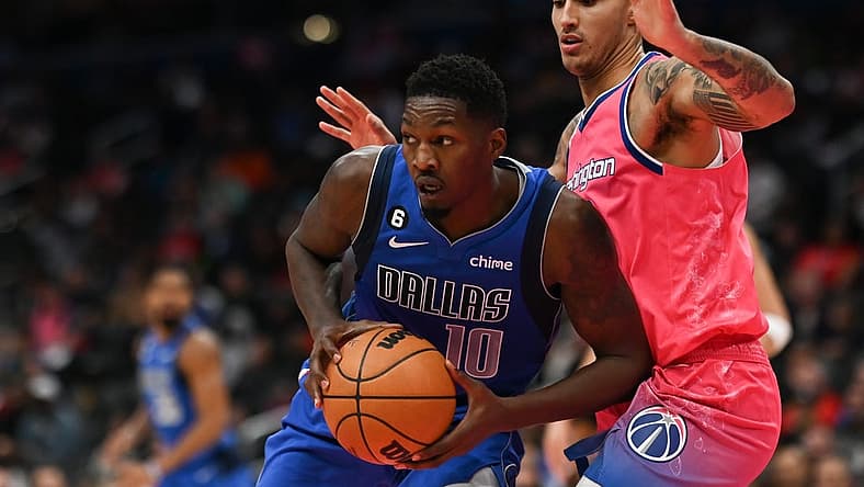 Nov 10, 2022; Washington, District of Columbia, USA;  Dallas Mavericks forward Dorian Finney-Smith (10) looks to pass as Washington Wizards forward Kyle Kuzma (33) defends during the first half at Capital One Arena. Mandatory Credit: Tommy Gilligan-USA TODAY Sports