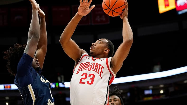Nov 10, 2022; Columbus, OH, USA; Ohio State Buckeyes guard Zed Key (23) shoots over Charleston Southern Buccaneers forward Taje' Kelly (14) during the first half of the NCAA men's basketball game at Value City Arena. Mandatory Credit: Adam Cairns-The Columbus Dispatch
Charleston Southern At Ohio State Men S Basketball