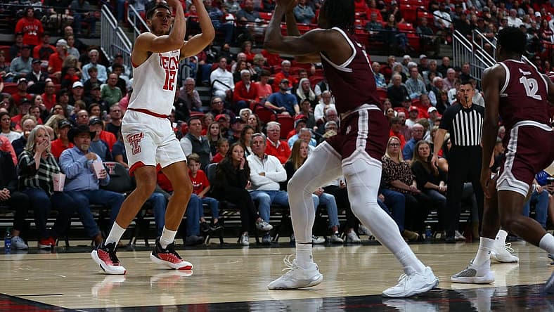 Nov 10, 2022; Lubbock, Texas, USA; Texas Tech Red Raiders forward Daniel Batcho (12) shoots the ball against Texas Southern Tigers forward Joirdon Karl Nicholas (5) in the first half at United Supermarkets Arena. Mandatory Credit: Michael C. Johnson-USA TODAY Sports