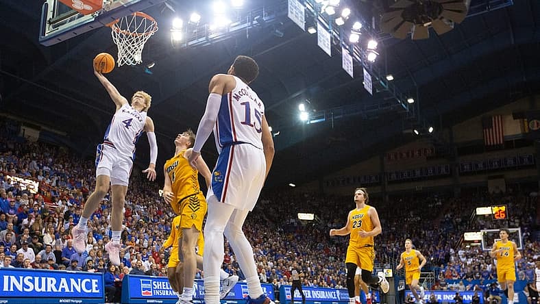 Kansas freshman guard Gradey Dick (4) jumps up for a dunk against North Dakota State in the second half of Thursday's game against North Dakota State inside Allen Fieldhouse.