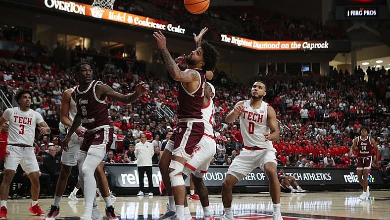 Nov 10, 2022; Lubbock, Texas, USA; Texas Southern Tigers forward Grayson Carter (25) goes after a loose ball in front of Texas Tech Red Raiders guard De   Vion Harmon (23) in the first half at United Supermarkets Arena. Mandatory Credit: Michael C. Johnson-USA TODAY Sports