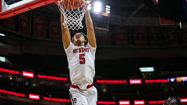Nov 11, 2022; Raleigh, North Carolina, USA; North Carolina State Wolfpack guard Jack Clark (5) dunks during the first half against Campbell Fighting Camels at PNC Arena. Mandatory Credit: Jaylynn Nash-USA TODAY Sports