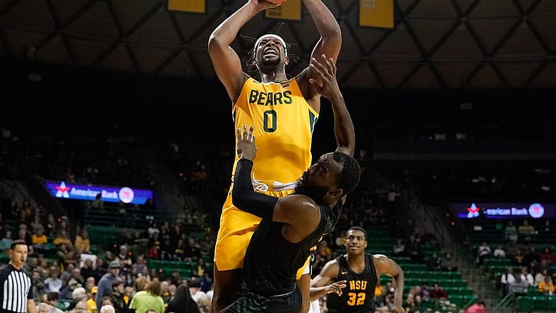 Nov 11, 2022; Waco, Texas, USA; Baylor Bears forward Flo Thamba (0) scores a basket while being fouled by Norfolk State Spartans guard Joe Bryant Jr. (4) during the first half at Ferrell Center. Mandatory Credit: Chris Jones-USA TODAY Sports