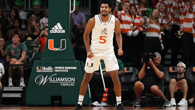 Nov 11, 2022; Coral Gables, Florida, USA; Miami Hurricanes guard Harlond Beverly (5) reacts after making a three point basket against the UNC Greensboro Spartans during the second half at Watsco Center. Mandatory Credit: Jasen Vinlove-USA TODAY Sports