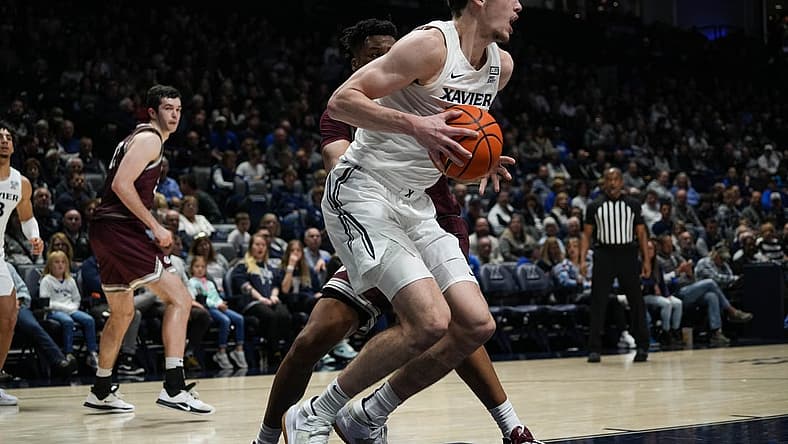 Xavier's Zach Freemantle recieves the ball under the hoop during the Xavier Musketeers vs. Montana Grizzlies game at the Cintas Center on Friday Nov. 11, 2022. The Musketeers lead the game 49-37 at halftime.