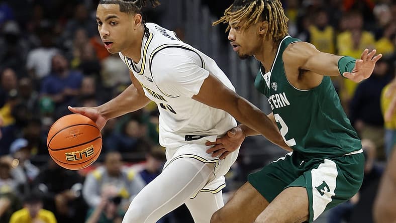 Nov 11, 2022; Detroit, Michigan, USA;  Michigan Wolverines guard Jett Howard (13) dribbles defended by Eastern Michigan Eagles guard Noah Farrakhan (2) in the first half at Little Caesars Arena. Mandatory Credit: Rick Osentoski-USA TODAY Sports