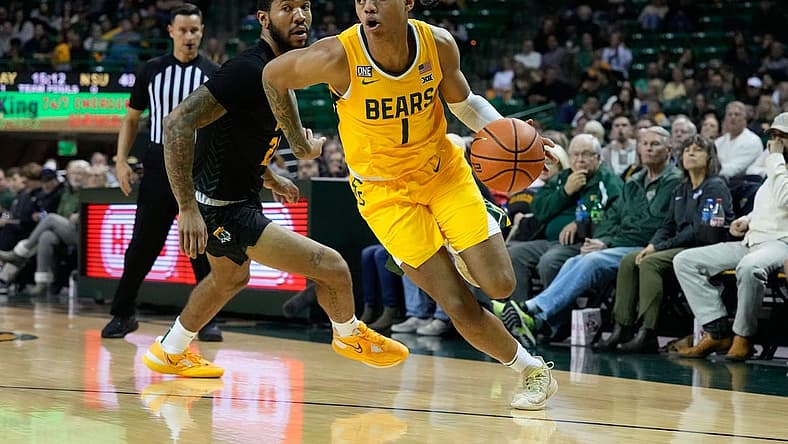 Nov 11, 2022; Waco, Texas, USA;  Baylor Bears guard Keyonte George (1) drives to the basket past Norfolk State Spartans forward Dana Tate Jr. (21) during the second half at Ferrell Center. Mandatory Credit: Chris Jones-USA TODAY Sports