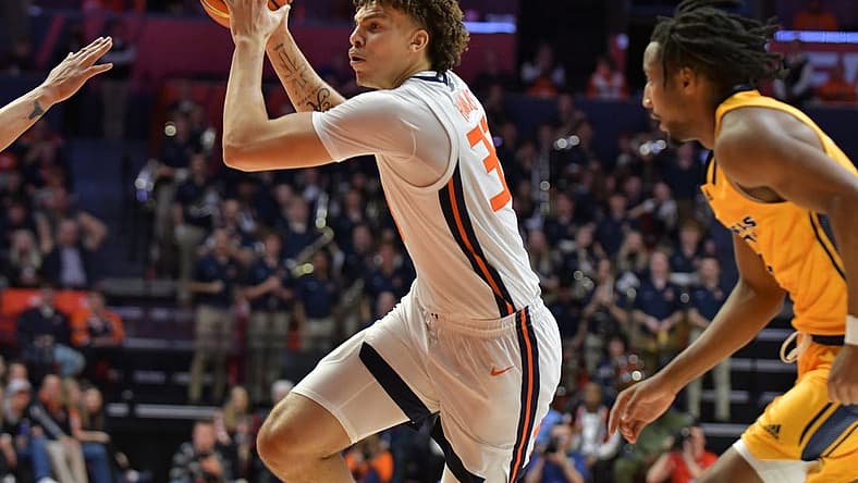 Nov 11, 2022; Champaign, Illinois, USA;  Illinois Fighting Illini forward Coleman Hawkins (33) drives to the basket during the first half against the UMKC Kangaroos at State Farm Center. Mandatory Credit: Ron Johnson-USA TODAY Sports