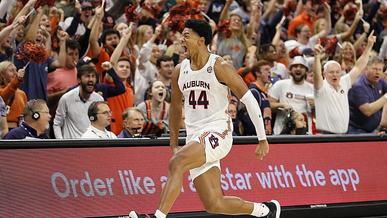 Nov 11, 2022; Auburn, Alabama, USA; Auburn Tigers center Dylan Cardwell (44) celebrates along the student section after blocking a South Florida Bulls shot during the second half at Neville Arena. Mandatory Credit: John Reed-USA TODAY Sports