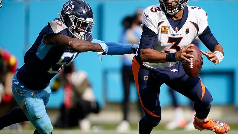 Nov 13, 2022; Nashville, Tennessee, USA; Denver Broncos quarterback Russell Wilson (3) is pressured by Tennessee Titans linebacker David Long Jr. (51) in the second quarter at Nissan Stadium. Mandatory Credit: George Walker IV-USA TODAY Sports