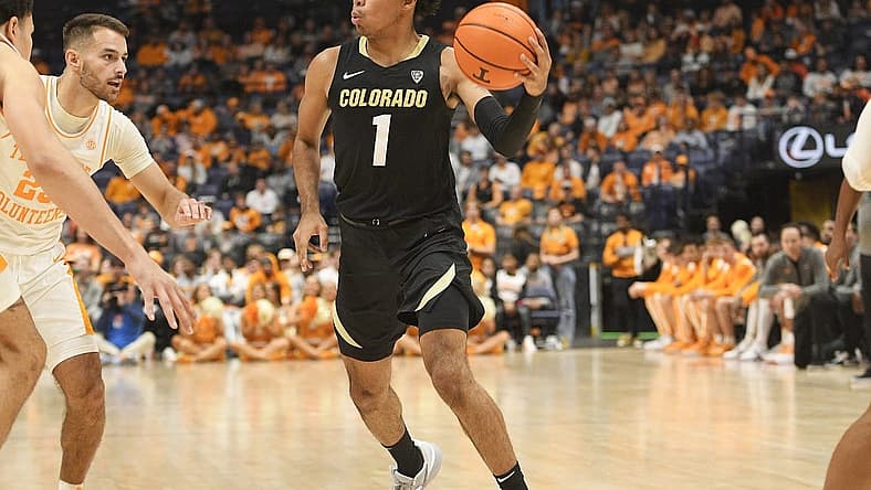 Nov 13, 2022; Nashville, Tennessee, USA; Colorado Buffaloes guard Julian Hammond III (1) passes the ball against the Tennessee Volunteers during the second half at Bridgestone Arena. Mandatory Credit: Steve Roberts-USA TODAY Sports