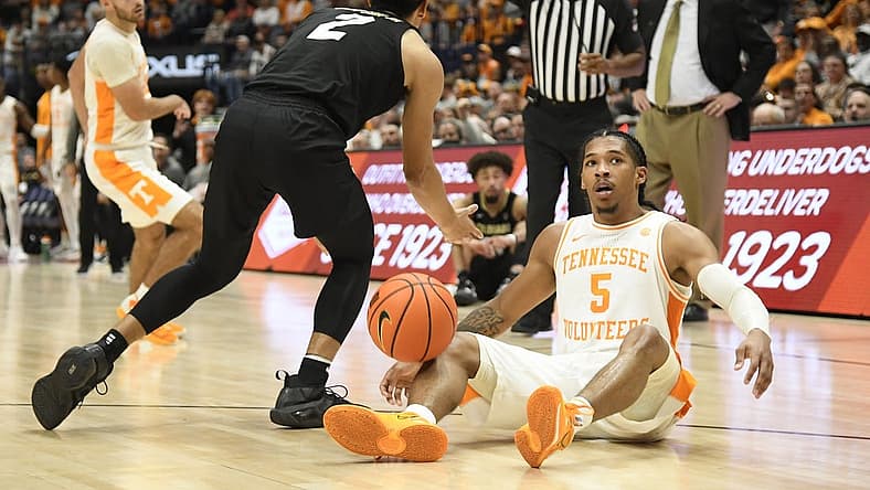 Nov 13, 2022; Nashville, Tennessee, USA;  Colorado Buffaloes guard KJ Simpson (2) is called for a foul as he steals the ball from Tennessee Volunteers guard Zakai Zeigler (5) during the second half at Bridgestone Arena. Mandatory Credit: Steve Roberts-USA TODAY Sports