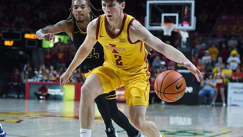 Iowa State University Cyclones guard Caleb Grill (2) drives past North Carolina A&T Aggies forward Webster Filmore (25)  during the first half at Hilton Coliseum Sunday, Nov. 13, 2022, in Ames, Iowa.  Photo by Nirmalendu Majumdar/Ames Tribune

Ncaa Men S Basketball