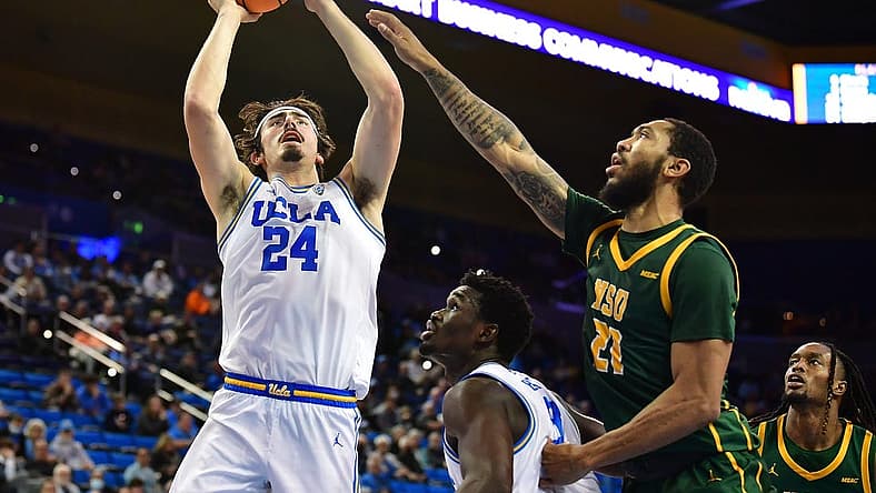 Nov 14, 2022; Los Angeles, California, USA; UCLA Bruins guard Jaime Jaquez Jr. (24) shoots against Norfolk State Spartans forward Dana Tate Jr. (21) during the first half at Pauley Pavilion. Mandatory Credit: Gary A. Vasquez-USA TODAY Sports