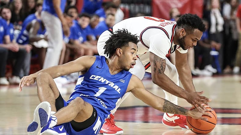 Nov 15, 2022; Queens, New York, USA;  St. John's Red Storm guard Posh Alexander (0) and Central Connecticut State Blue Devils guard Jay Rodgers (1) fight for a loose ball in the first half at Carnesecca Arena. Mandatory Credit: Wendell Cruz-USA TODAY Sports