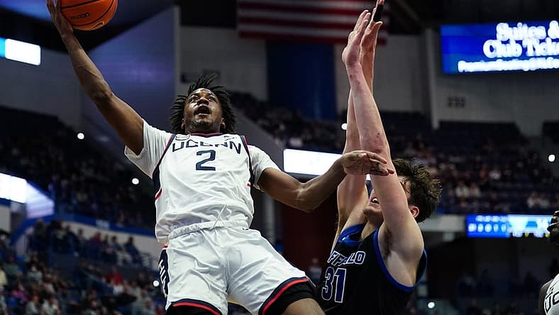 Nov 15, 2022; Hartford, Connecticut, USA; Connecticut Huskies guard Tristen Newton (2). Shoots against Buffalo Bulls center Isaac Jack (31) in the first half at XL Center. Mandatory Credit: David Butler II-USA TODAY Sports