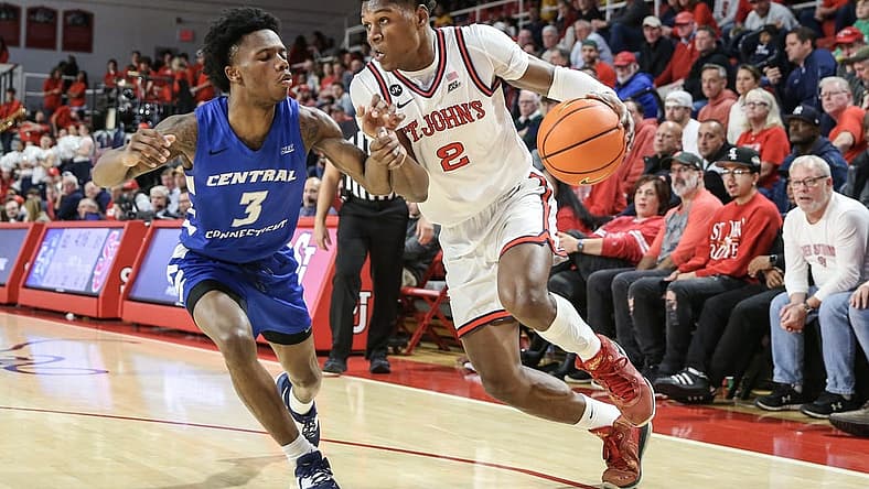 Nov 15, 2022; Queens, New York, USA; St. John's Red Storm guard AJ Storr (2) drives past Central Connecticut State Blue Devils guard Nigel Scantlebury (3) in the second half at Carnesecca Arena. Mandatory Credit: Wendell Cruz-USA TODAY Sports