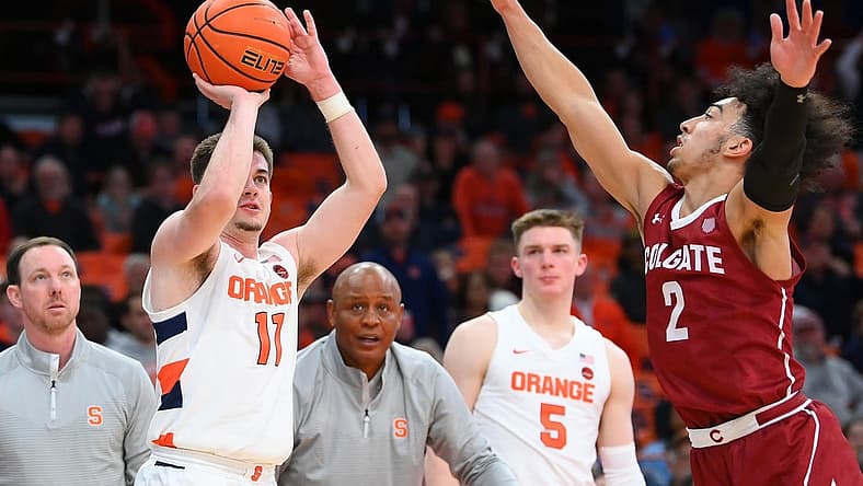 Nov 15, 2022; Syracuse, New York, USA; Syracuse Orange guard Joseph Girard III (11) shoots the ball against the defense of Colgate Raiders guard Braeden Smith (2) during the second half at the JMA Wireless Dome. Mandatory Credit: Rich Barnes-USA TODAY Sports