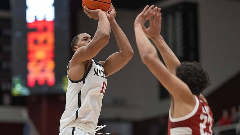 Nov 15, 2022; Stanford, California, USA; San Diego State Aztecs forward Jaedon LeDee (13) shoots over Stanford Cardinal forward Brandon Angel (23) during the first half at Maples Pavilion. Mandatory Credit: Stan Szeto-USA TODAY Sports