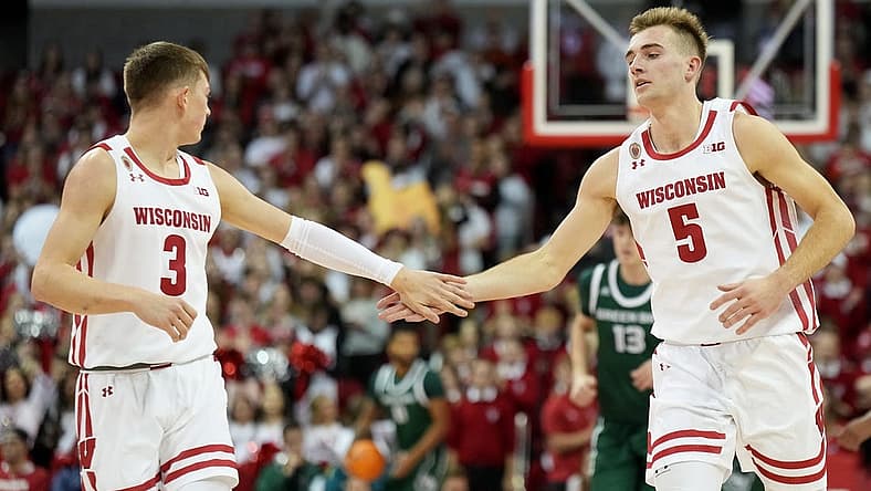 Nov 15, 2022; Madison, Wisconsin, USA; Wisconsin Badgers guard Connor Essegian (3) congratulates Wisconsin Badgers forward Tyler Wahl (5) on scoring against the Green Bay Phoenix during the first half at the Kohl Center. Mandatory Credit: Kayla Wolf-USA TODAY Sports