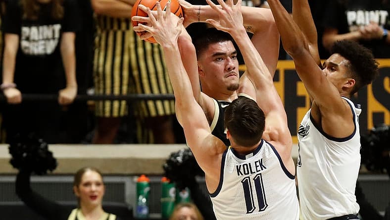 Purdue Boilermakers center Zach Edey (15) is guarded by Marquette Golden Eagles guard Tyler Kolek (11) and Marquette Golden Eagles forward Oso Ighodaro (13) during the NCAA men s basketball game, Tuesday, Nov. 15, 2022, at Mackey Arena in West Lafayette, Ind. Purdue won 75-70.
Purduemarquettembb111522 Am34173