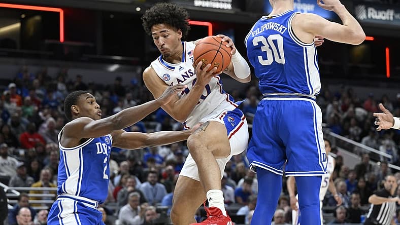Nov 15, 2022; Indianapolis, Indiana, USA; Kansas Jayhawks forward Jalen Wilson (10) grabs a rebound in front of Duke Blue Devils guard Jaylen Blakes (2) during the first half at Gainbridge Fieldhouse. Mandatory Credit: Marc Lebryk-USA TODAY Sports