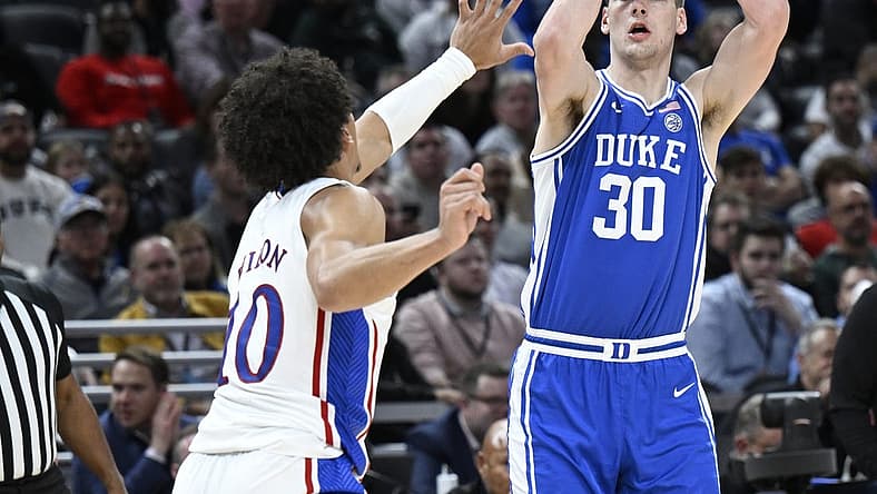 Nov 15, 2022; Indianapolis, Indiana, USA;  Duke Blue Devils center Kyle Filipowski (30) shoots the ball over Kansas Jayhawks forward Jalen Wilson (10) during the first half at Gainbridge Fieldhouse. Mandatory Credit: Marc Lebryk-USA TODAY Sports