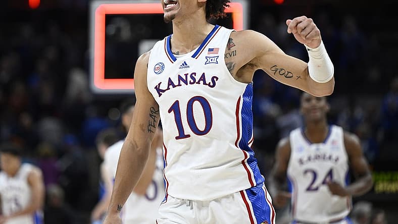 Nov 15, 2022; Indianapolis, Indiana, USA;  Kansas Jayhawks forward Jalen Wilson (10) reacts to defeating the Duke Blue Devils after the game at Gainbridge Fieldhouse. Jayhawks defeat the Blue Devils 69 to 64. Mandatory Credit: Marc Lebryk-USA TODAY Sports