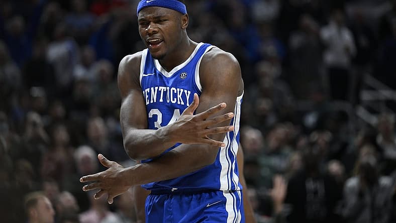 Nov 15, 2022; Indianapolis, Indiana, USA; Kentucky Wildcats forward Oscar Tshiebwe (34) reacts to blocking a shot during the second half against the Michigan State Spartans at Gainbridge Fieldhouse. Spartans defeat the Wildcats 86 to 77 in double overtime. Mandatory Credit: Marc Lebryk-USA TODAY Sports