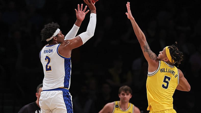 Nov 16, 2022; Brooklyn, New York, USA; Pittsburgh Panthers forward Blake Hinson (2) shoots the ball as Michigan Wolverines forward Terrance Williams II (5) defends during the first half at Barclays Center. Mandatory Credit: Vincent Carchietta-USA TODAY Sports