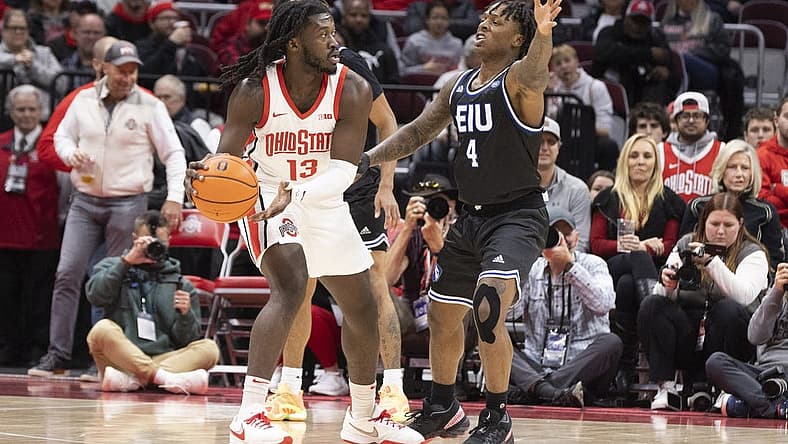 Nov 16, 2022; Columbus, Ohio, USA; Ohio State Buckeyes guard Isaac Likekele (13) looks for an open teammate as Eastern Illinois Panthers guard Yaakema Rose Jr. (4) defends in the first half at Value City Arena. Mandatory Credit: Greg Bartram-USA TODAY Sports