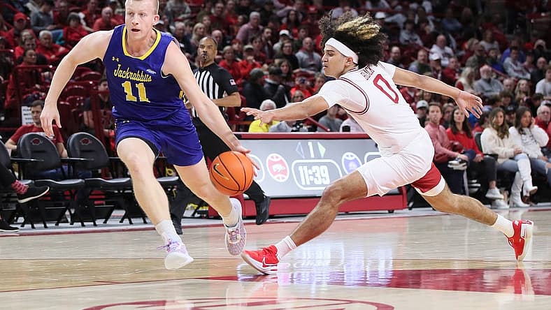 Nov 16, 2022; Fayetteville, Arkansas, USA; Arkansas Razorbacks guard Anthony Black (0) steals the ball from South Dakota State Jackrabbits guard Matthew Mors (11) in the first half at Bud Walton Arena. Mandatory Credit: Nelson Chenault-USA TODAY Sports