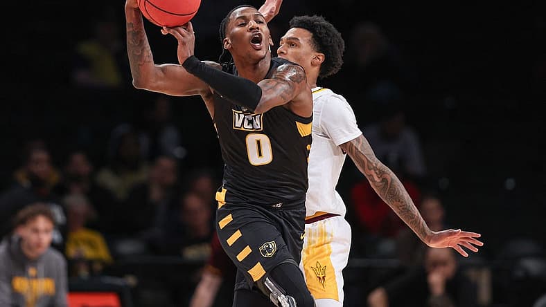 Nov 16, 2022; Brooklyn, New York, USA; Virginia Commonwealth Rams forward Jamir Watkins (0) reacts against Arizona State Sun Devils guard Desmond Cambridge Jr. (4) during the first half at Barclays Center. Mandatory Credit: Vincent Carchietta-USA TODAY Sports