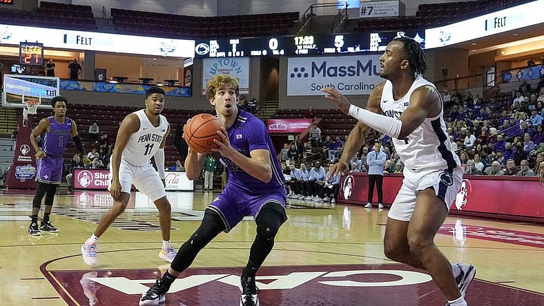 Nov 17, 2022; Charleston, South Carolina, USA; Furman Paladins guard Carter Whitt (11) sets for a shot in the first half against the Penn State Nittany Lions at TD Arena. Mandatory Credit: David Yeazell-USA TODAY Sports